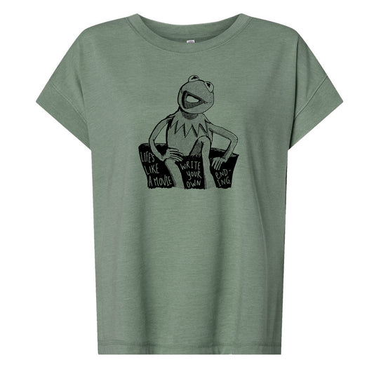 A green t-shirt with a graphic design featuring a frog character and text that reads "Life's like a movie, write your own ending".