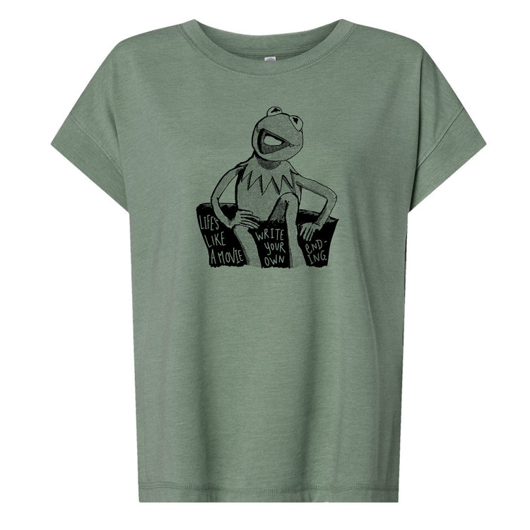 A green t-shirt with a graphic design featuring a frog character and text that reads "Life's like a movie, write your own ending".