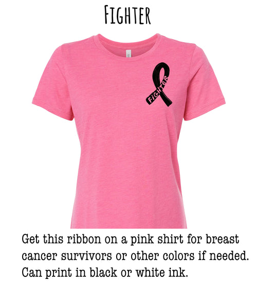 A pink t-shirt with a black ribbon on the front, which is commonly associated with breast cancer awareness.