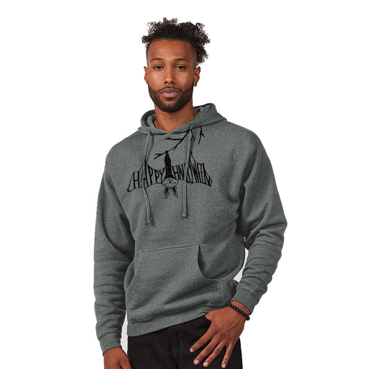 A man wearing a grey hoodie with a graphic design on it, standing against a white background.