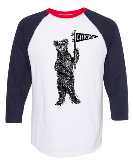 A white and red baseball-style t-shirt with a graphic of a bear holding a Chicago flag.