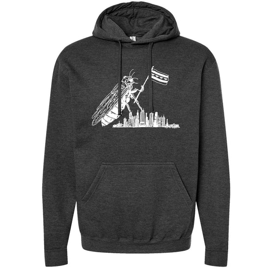 A hooded sweatshirt with a graphic design depicting a large insect, possibly a bee or wasp, flying over a city skyline.