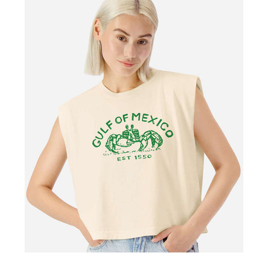 A woman wearing a beige sleeveless t-shirt with a graphic design of a green crab and the text "Gulf of Mexico" printed on it.