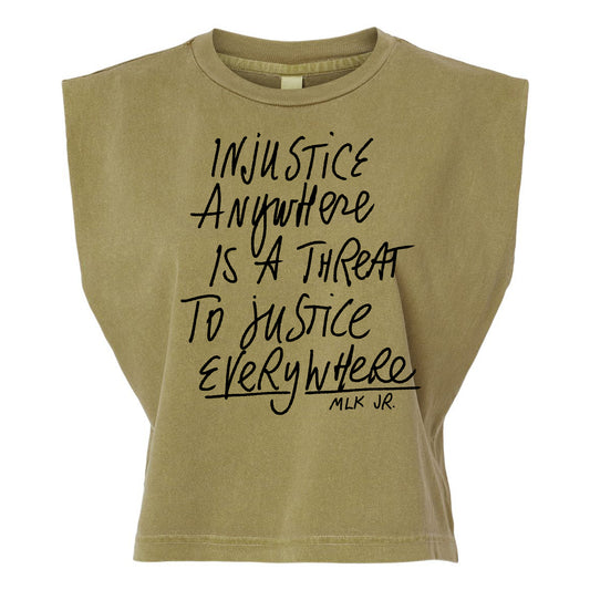 a beige t-shirt with a printed message that reads "Injustice anywhere is a threat to justice everywhere" and the name "MLK JR."