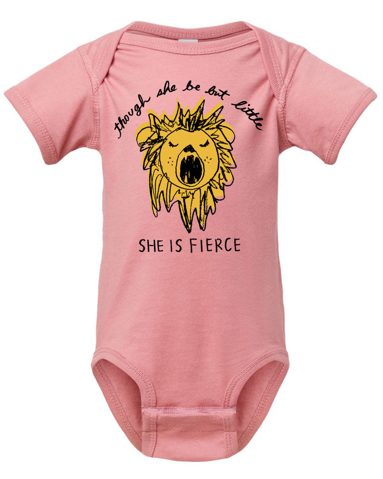 A pink baby onesie with a yellow lion graphic and the text "She is fierce" printed on it.