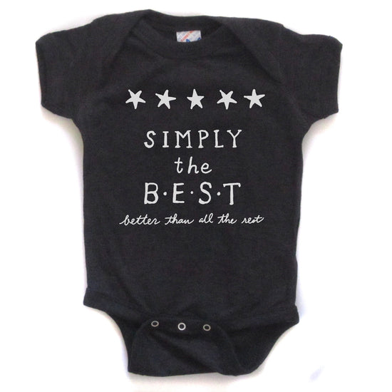 A black baby onesie with white text and stars on it.