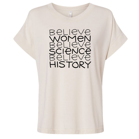 A white t-shirt with the text "Believe Women Believe Science Believe History" printed on it in a blocky font.