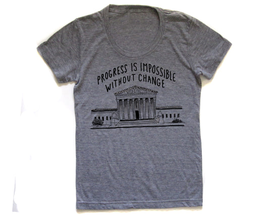 a gray t-shirt with a graphic design depicting a building and the text "Progress is Impossible Without Change" printed on it.