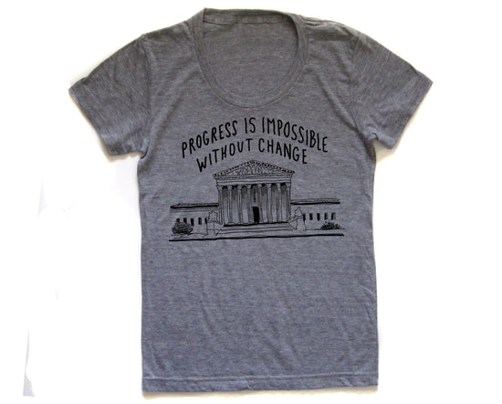 a gray t-shirt with a graphic design depicting a building and the text "Progress is Impossible Without Change" printed on it.