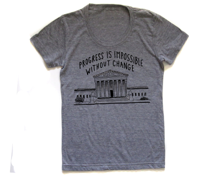 a gray t-shirt with a graphic design depicting a building and the text "Progress is Impossible Without Change" printed on it.