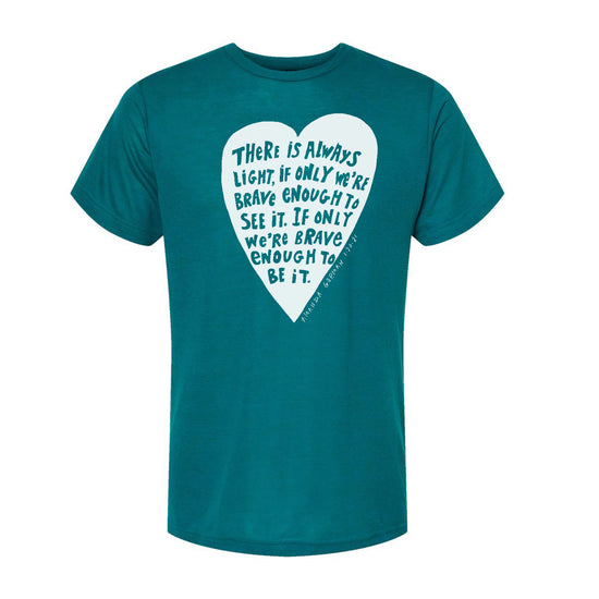 A teal-colored t-shirt with a white heart-shaped graphic containing a motivational quote about being brave and seeing it as a source of strength.