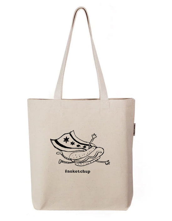 A beige tote bag with a black and white graphic design depicting a hot dog with stars on it.