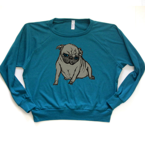 A teal-colored long-sleeved shirt with a graphic of a pug dog printed on it.