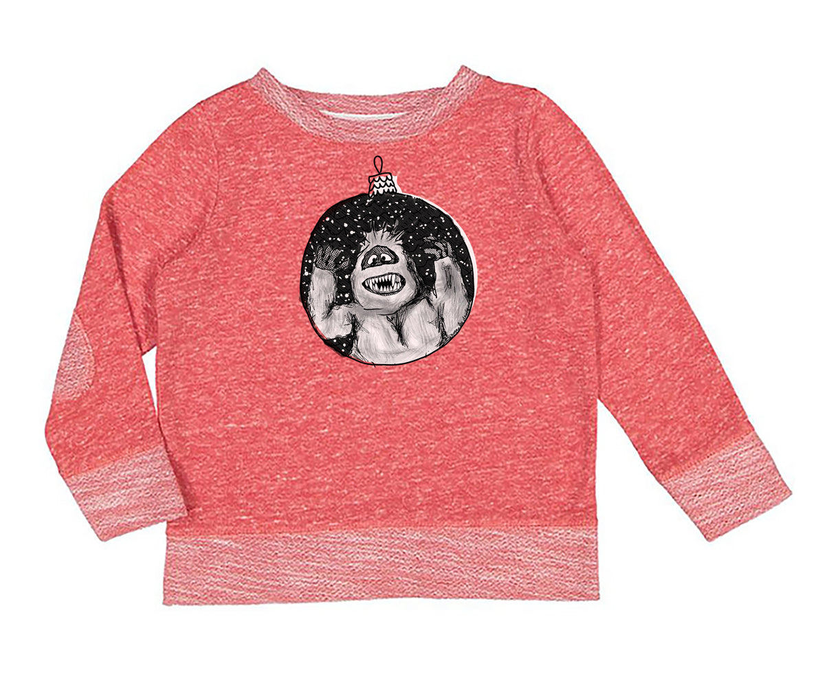 A red long-sleeved sweater with a graphic of a monster or monster-like figure on the front.