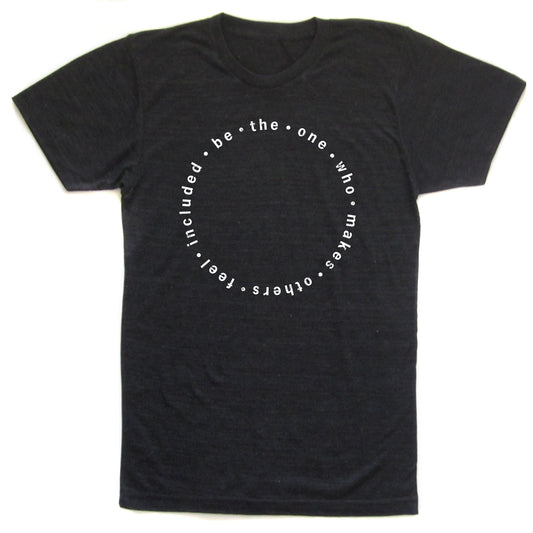 A black t-shirt with a white circular design featuring the text "be - the - one - who - makes - others" arranged in a circular pattern.