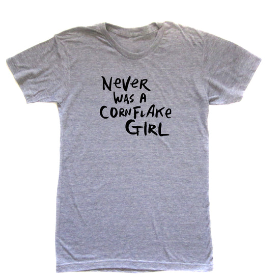 A gray t-shirt with the text "NEVER WAS A CORNFLAKE GIRL" printed on it.