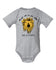 A grey onesie with a yellow lion graphic and the text "She is fierce" printed on it.