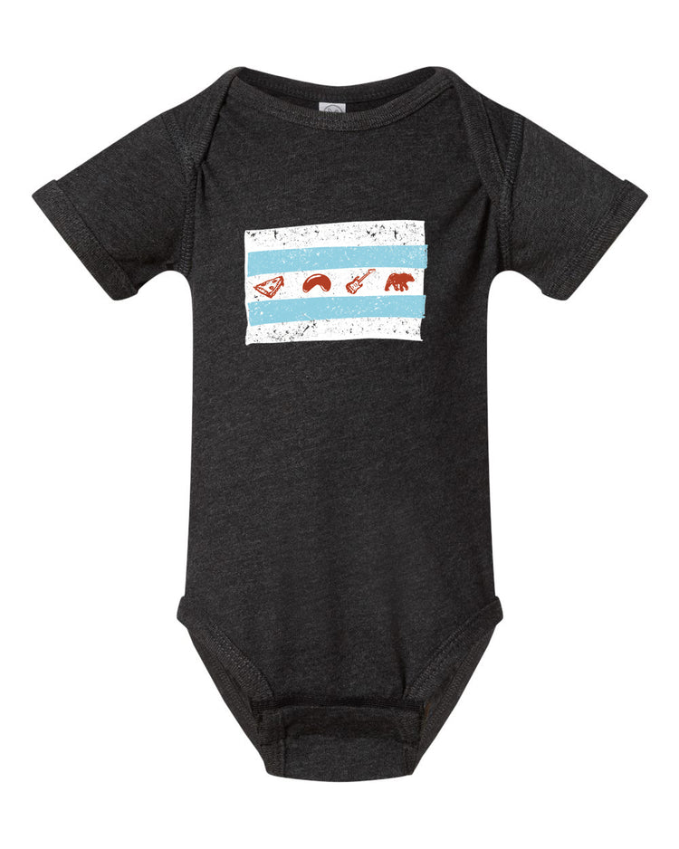 A black baby onesie with a graphic design on the front, depicting a flag with various symbols.