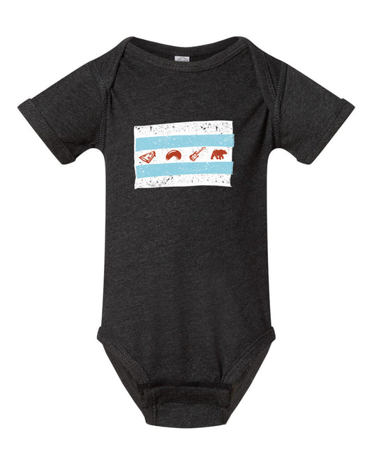 A black baby onesie with a graphic design on the front, depicting a flag with various symbols.