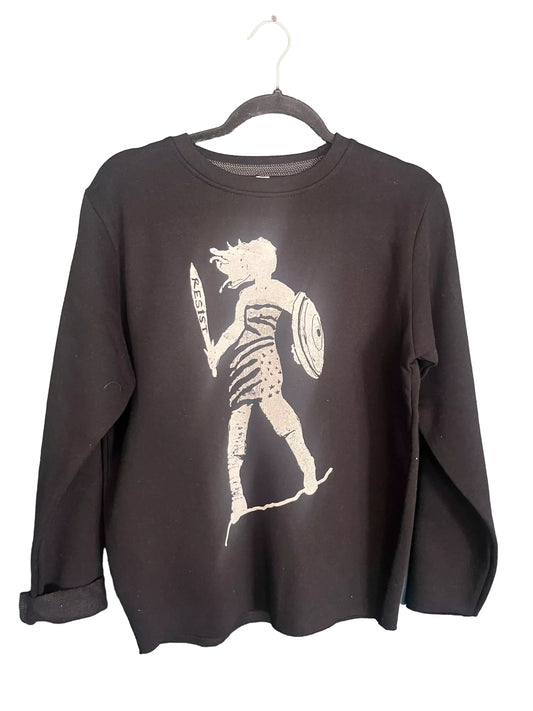 A black long-sleeved shirt with a white graphic design depicting a person holding a shield and a sword.