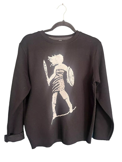 A black long-sleeved shirt with a white graphic design depicting a person holding a shield and a sword.