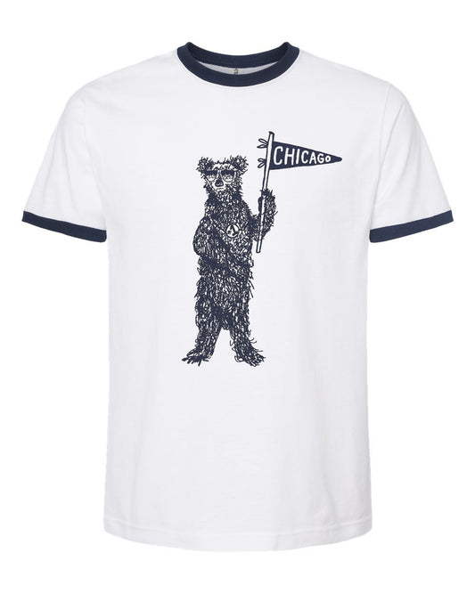A white t-shirt with a graphic design of a bear holding a Chicago flag.