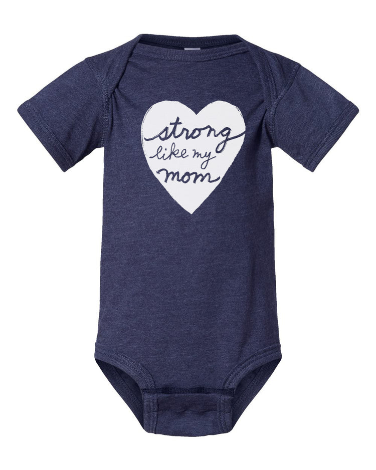 A navy blue baby onesie with a white heart-shaped graphic and the text "Strong like my mom" printed on it.