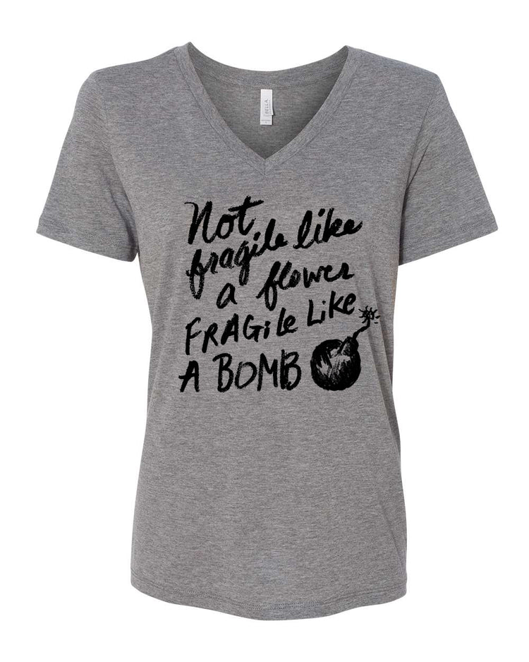 A gray t-shirt with a black text design that reads "Not fragile like a flower, fragile like a bomb".