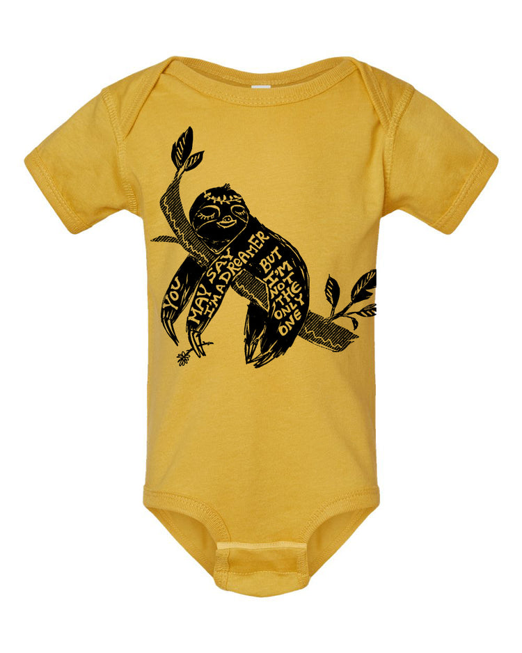 A yellow baby onesie with a black graphic design depicting a sloth.