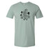 A light green t-shirt with a graphic design featuring a mushroom and leaves, along with the text "I spent among trees is never wasted".