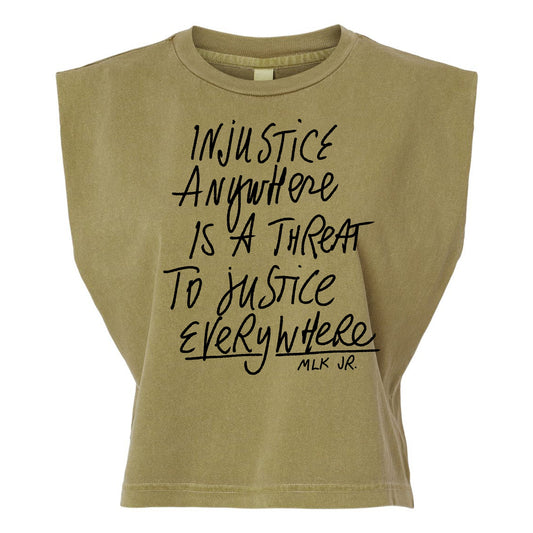 a beige t-shirt with a printed message that reads "Injustice anywhere is a threat to justice everywhere" and the name "MLK JR."