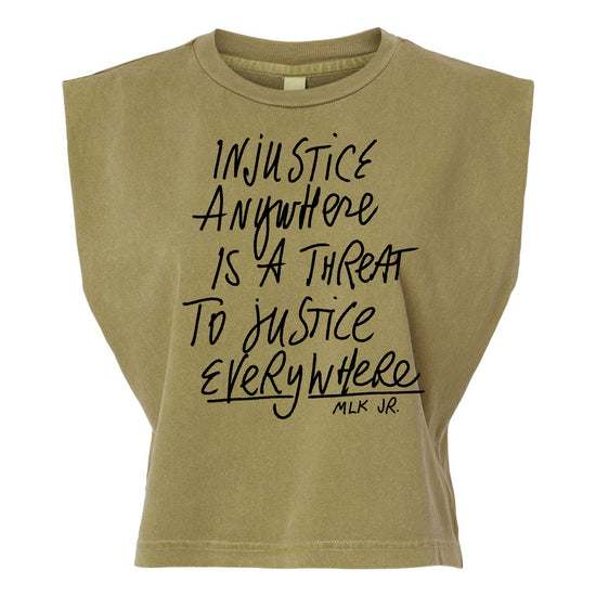 a beige t-shirt with a printed message that reads "Injustice anywhere is a threat to justice everywhere" and the name "MLK JR."