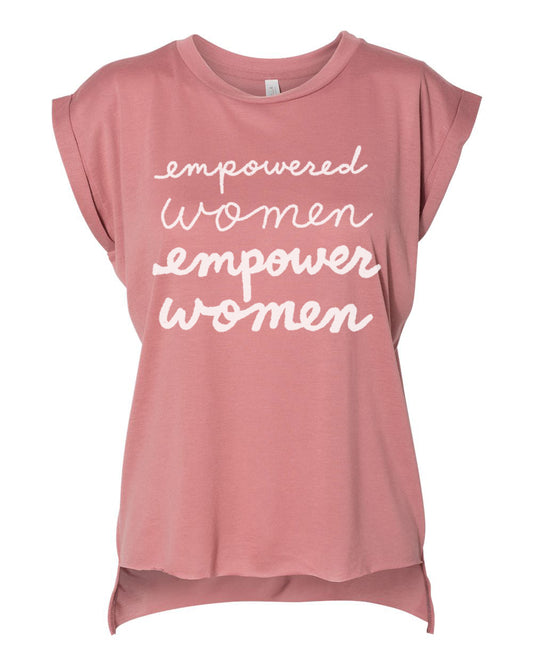 A pink t-shirt with the text "empowered women empower women" printed on it in white lettering.