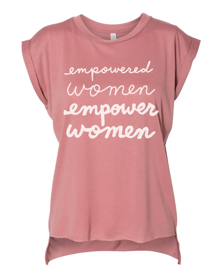 A pink t-shirt with the text "empowered women empower women" printed on it in white lettering.