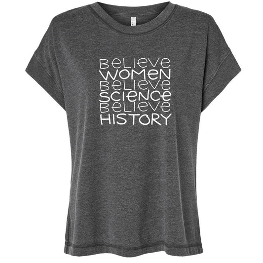 A gray t-shirt with the text "Believe Women Believe Science Believe History" printed on it in white lettering.
