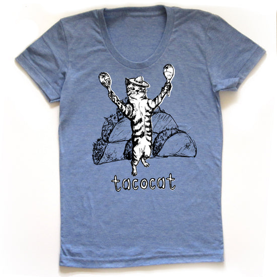 A blue t-shirt with a graphic design depicting a cat holding two tacos and the word "tacocat" written below the image.