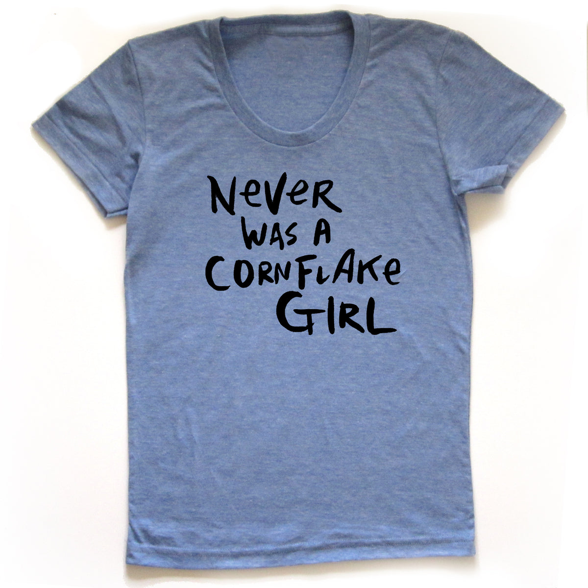 A light blue t-shirt with the text "Never was a Cornflake Girl" printed on it.