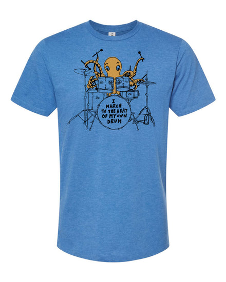 A blue t-shirt with an illustration of an octopus playing a drum set, accompanied by the text "I MUST reach to the BEAT of the DRUM".