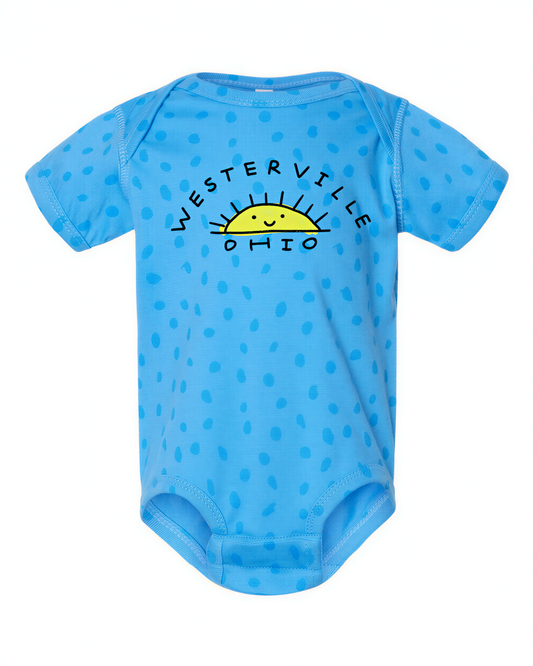 A blue baby onesie with a sun design and the text "WESTERVILLE OHIO" printed on it.