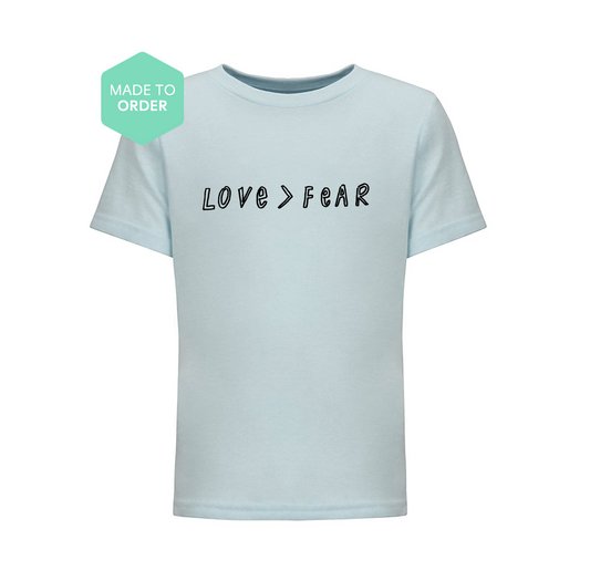 a t - shirt with the words love fear printed on it