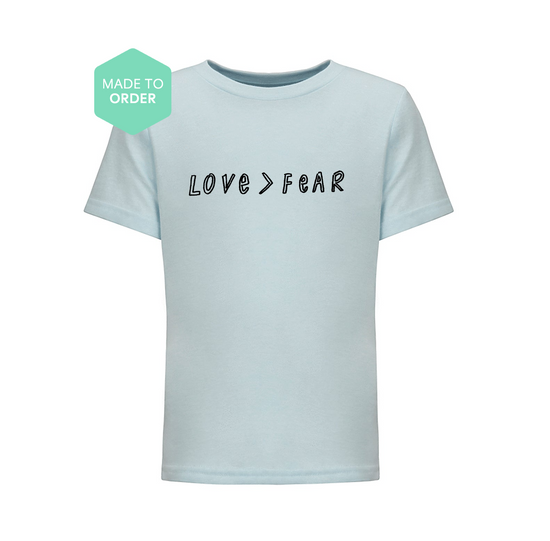 a t - shirt with the words love fear printed on it