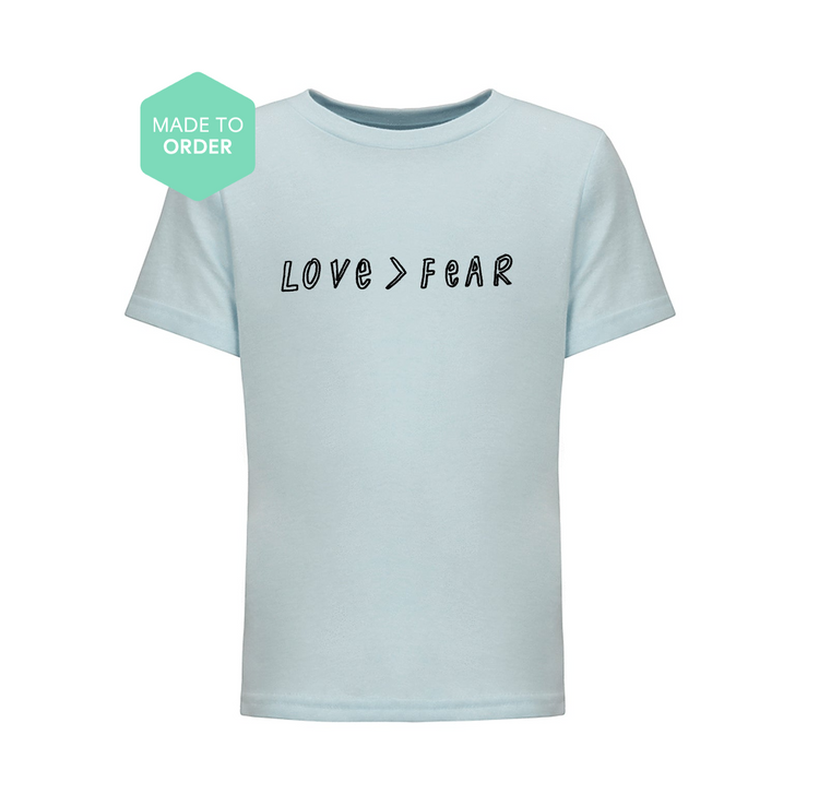 a t - shirt with the words love fear printed on it
