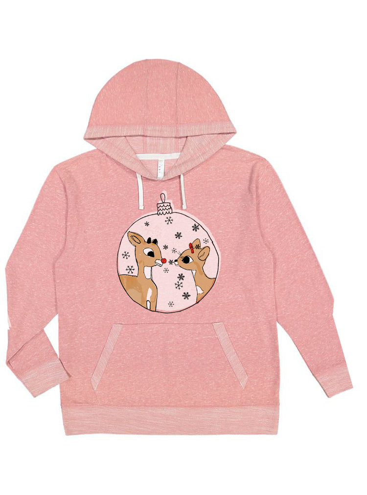 A pink hoodie with a graphic of two cartoon reindeer inside a snow globe.