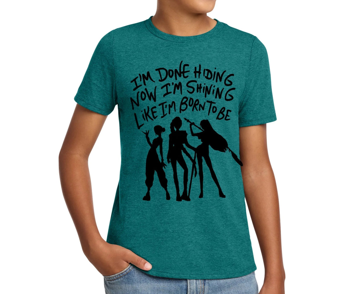A young boy wearing a green t-shirt with a graphic design and text printed on it.