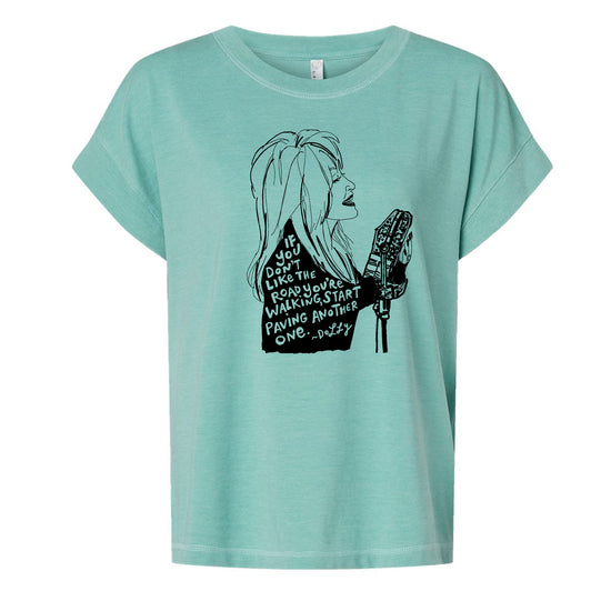 A turquoise t-shirt with a black graphic design depicting a woman's profile with text overlaid.