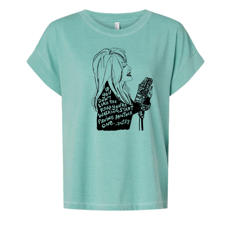 A turquoise t-shirt with a black graphic design depicting a woman's profile with text overlaid.