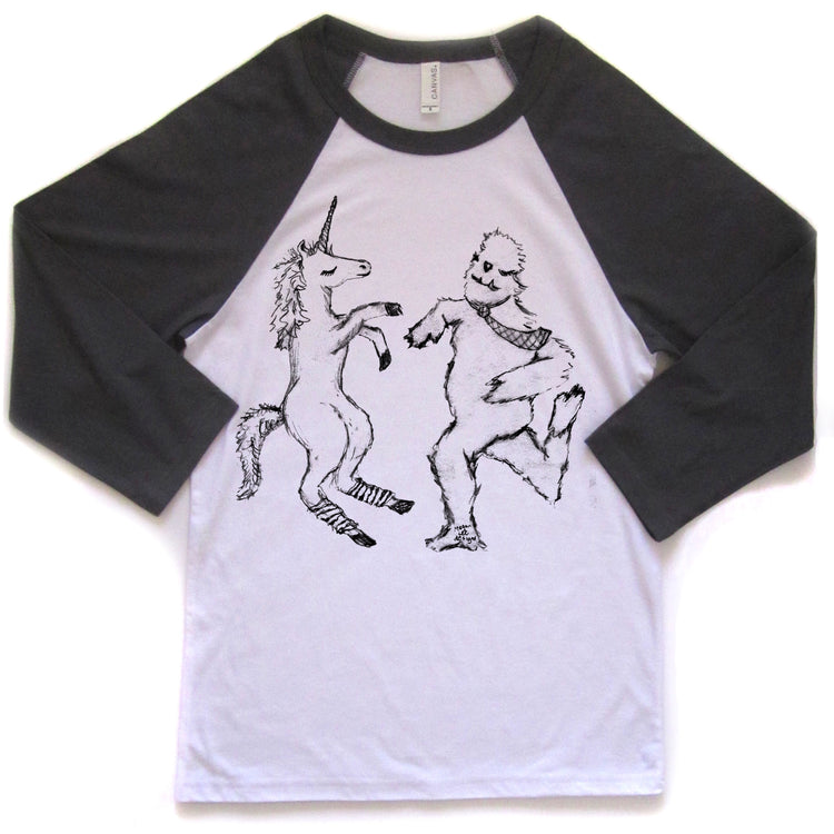 a white and black t-shirt with a graphic design depicting a unicorn and a creature resembling a bear or similar animal.