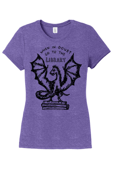 a women's purple t - shirt with an image of a dragon on it