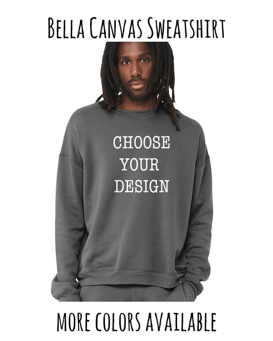 A man with dreadlocks wearing a gray sweatshirt with the text "Choose your design" printed on it.