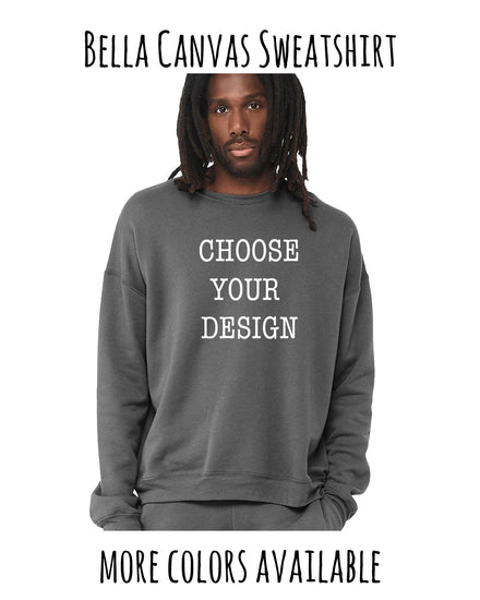 A man with dreadlocks wearing a gray sweatshirt with the text "Choose your design" printed on it.